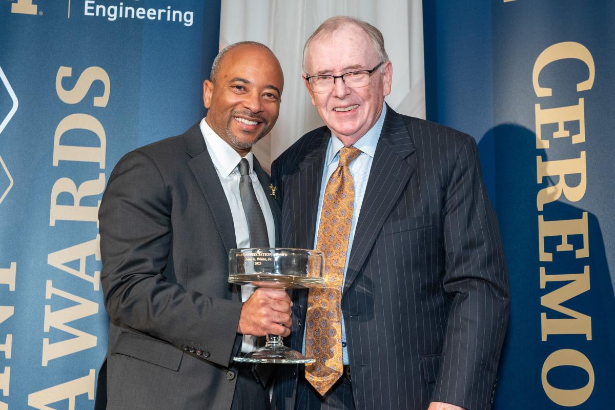 Raheem Beyah with John White, holding trophy